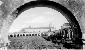 View of the Mission San Luis Rey de Francia, shown through an archway, ca.1887