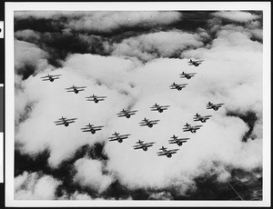 Group of biplanes flying in formation, ca.1950