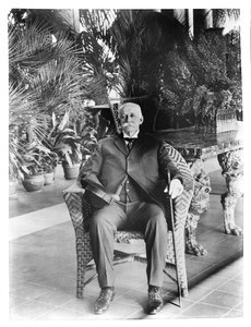 Henry E. Huntington sitting in a chair at his residence, ca.1927