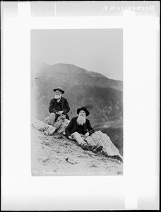 Two old men, Owen Brown and Jason Brown, sitting on a rocky slope on Mount Wilson, 1887