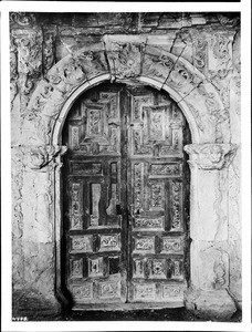 Richly carved door of a mission in Arizona or Texas, ca.1900