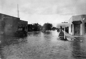 View of the flooded intersection of Sixty-fifth Street and Normandie Avenue, January 16, 1932