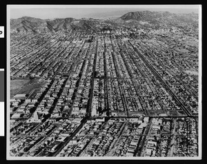 Aerial view looking north of Wilshire Boulevard between La Brea Avenue and Highland Avenue, January 23, 1936