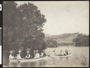 Men, women, and children in rowboats on the Russian River