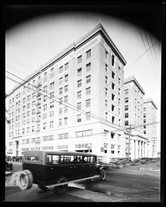 Bus passing in front of the Chamber of Commerce building in Los Angeles