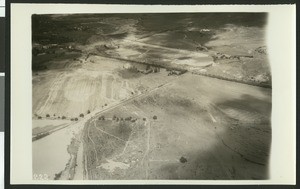 Aerial view of flooding near Colton, showing water flooding roads, ca.1930