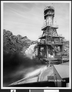 "Battleship" tanks, which simulate the configuration of an atlas ICBM, feeding propellants to the engine being test fired, ca.1955