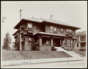 Exterior view of a two-story Craftsman-style house on Carondelet Street in Los Angeles