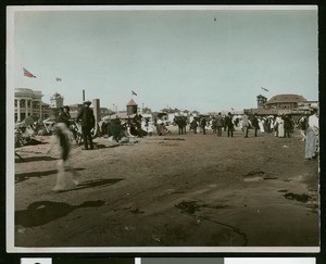 Hand-colored panoramic view of bathers near the pier in Long Beach, ca.1915