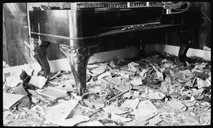 Ruined piano inside a run-down room