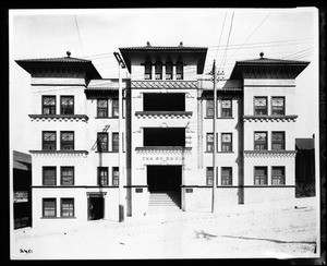 Exterior view of the Saint Regis Apartments on Flower Street