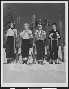 Four women skiers posing, ca.1930