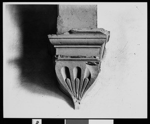 Decoration at the base of a column at a mission, ca.1900