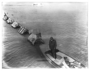 Patriotic flower floats being towed out to sea, Los Angeles