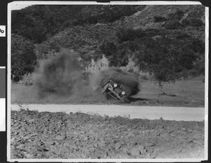 Car falling over, ca.1920