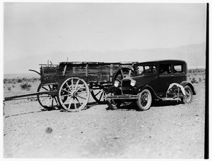 Automobile and wagon in the desert