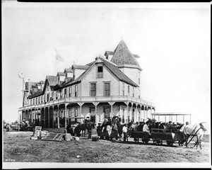 Travelers outside the Hotel Wilmore on opening day in Long Beach, 1887