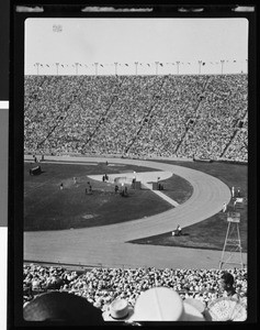 Crowd watching a horse-jumping event at the Coliseum, showing referee stand at right, 1932