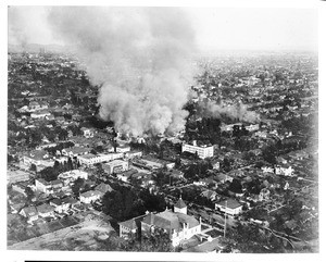 Aerial view looking east at a fire at the Shrine Auditorium, 1920