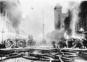 Los Angeles Fire Department fighting a fire on Broadway looking north from Third Street, ca.1913