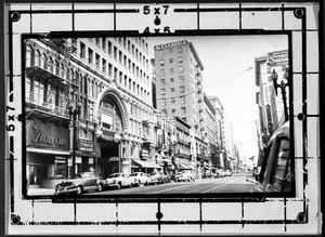 View of Spring Street looking toward Fifth Street in Los Angeles, showing the Arcade Building and the Alexandria Hotel, ca.1953