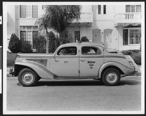 Side view of a 1939 or 1940 Yellow Cab Company Packard taxi, ca.1940