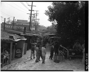 Restaurants and shops along a narrow alley in Los Angeles