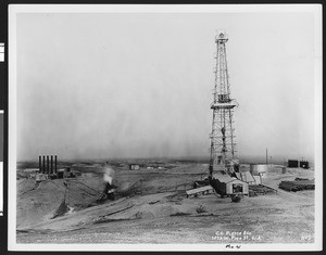 Kettleman Hills Oil Field, featuring a prominent derrick, ca.1931