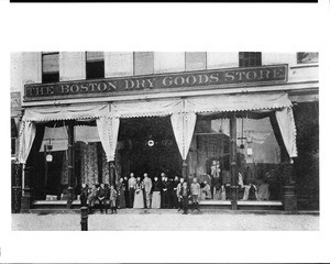 Portrait of people posed outside the Boston Dry Goods Store, Los Angeles, ca.1886