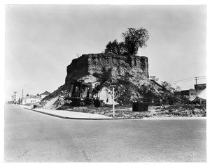 Hill being removed at the intersection of East Third Street and Beacon Street in San Pedro, Los Angeles, ca.1920