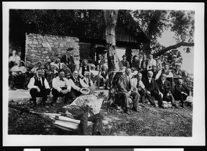 Members of the Sunset Club gathered outside a cabin, ca.1900