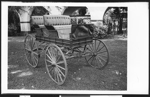 Parrot Carriage Company carriage in what appears to be a courtyard, ca.1950