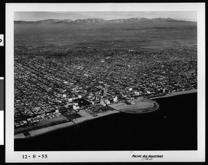 Aerial view of Long Beach, looking northeast over the city from the ocean, December 8, 1955