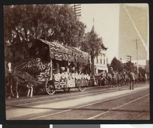 Parade with a float, ca.1920
