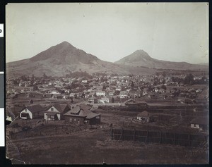 View of San Luis Obispo, showing a picket fence in the foreground, ca.1900