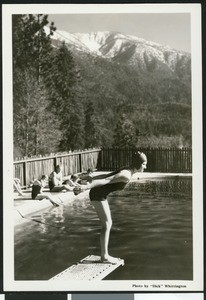 Woman preparing to dive into a pool at Camp Radford by "Dick" Whittington, ca.1930