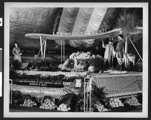 Orange display at a fair, depicting the first gold strike in Los Angeles County, ca.1930