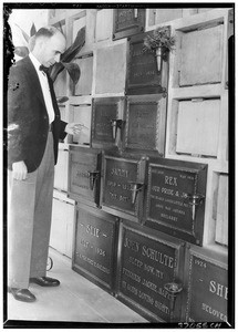 Man next to graves at the Los Angeles Pet Cemetery, 1937