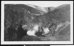 Mining equipment along a sheer cliff face, ca.1905