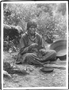 Paiute Indian woman making basket in the Yosemite Valley, ca.1900-1902