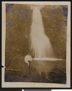 Woman posing in front of Sotoyome Falls near Healdsburg, ca.1900