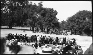 Outdoor play showing a band and a group dressed like Native Americans, Claremont, ca.1930