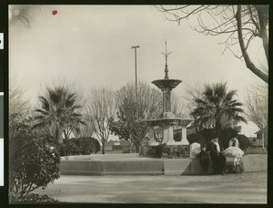 Park-goers standing in front of a fountain in Laura Park, Merced, ca.1910