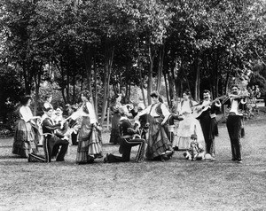 Portrait of six couples of "La Jota" Spanish Dancers with the men kneeling, led by Jose Rivera, Los Angeles, ca.1910