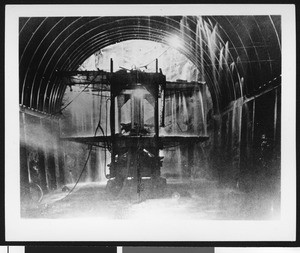 Interior view of construction of the Colorado River Aqueduct, showing a machine inside, ca.1930