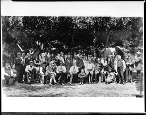 Group portrait of the Sunset Club outside under the trees, ca.1910