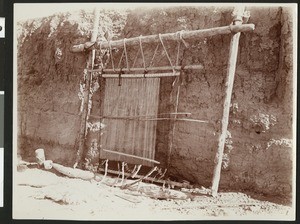 Empty Navajo loom on the bank of a river