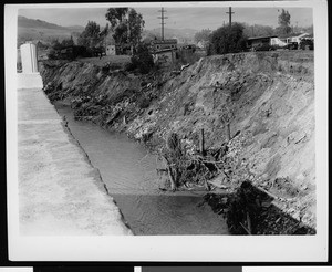 Flood damage to a bridge and bank, 1938