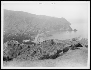 Panoramic view of Avalon Harbor at a distance from the south, showing hills in foreground, Santa Catalina Island, ca.1900-1905