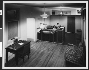 Interior of Logistics Research Inc., featuring the entrance to the main plant and offices, ca.1950